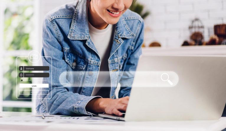 young-business-woman-using-laptop-computer-working-typing-keyboard-with-search-bar-business-browsing-internet-web-data-information-banner-network-searching-technology-concept